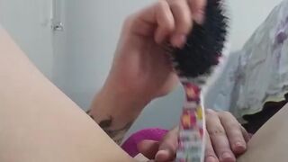 punching a brush in the pussy